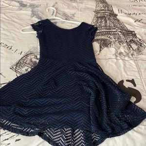 It’s a navy blue skater midi dress